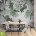 Fototapeta na wymiar z dużymi zielonymi liśćmi na spękanym tle – botaniczna dekoracja ścienna do jadalni lub kuchni