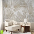Beżowa tapeta na ścianie z motywem liści bananowca na ścianie w jasnym, nowoczesnym wnętrzu – elegancka dekoracja ścienna idealna do salonu lub kącika wypoczynkowego w stylu naturalnym