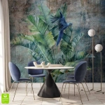 Fototapeta na wymiar - Niebieska papuga na liściach bananowca