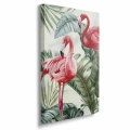 obraz-na-plotnie-flamingi-w-zielonych-lisciach-bok-pion.webp