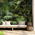 Zielona fototapeta na ścianę z motywem gęstej dżungli, naklejona we wnętrzu za jasną, drewnianą kanapą