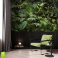Nowoczesna fototapeta na ścianę z motywem ciemnej dżungli, umieszczona w eleganckim salonie nad czarną boazerią