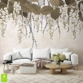 Nowoczesna fototapeta 3D z efektem głębi, przedstawiająca wiszące gałęzie kwiatów za białą sofą w jasnym salonie