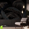 Elegancka fototapeta na wymiar w złote, tropikalne liście na czarnym tle, umieszczona w salonie w stylu glamour