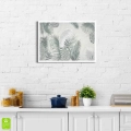 plakat-biała-ramka-wnetrze-egzotyczne- liscie-palmy-i-monstery-do-sypialni-salonu.webp