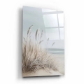 obraz-na-szkle-akrylowym-plaza-z-trawami-bok-pion.webp