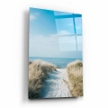 obraz-na-szkle-akrylowym-malowniczy-widok-morza-sciezka-przez-wydmy-na-plazy-bok-pion.webp