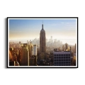 Plakat-panorama-nowego-jorku-w-sloncu-czarna-rama_web.webp