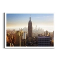Plakat-panorama-nowego-jorku-w-sloncu-biala-rama_web.webp