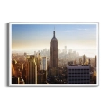 Plakat-panorama-nowego-jorku-w-sloncu-srebrna-rama_web.webp