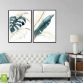zestaw-2-plakatow-liscie-monstery-bananowca-zloty-turkusowy-czarna-wnetrze.webp