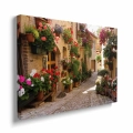obraz-na-plotnie-urokliwa-wloska-uliczka-3-d-w-spello-bok.webp