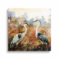 obraz-szklo-czaple-na-tle-jesiennego- krajobrazu-kwadrat.webp